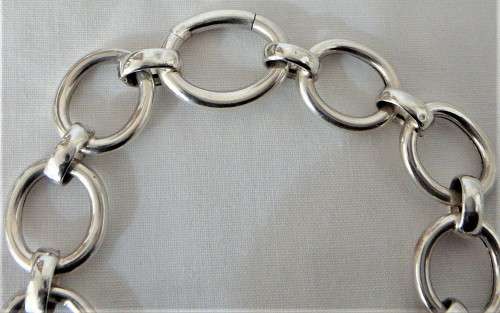 A Silver Bracelet of Hollow Silver Rings with an Unusual Hinged Ring Clasp
