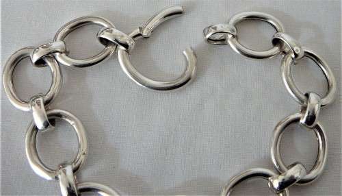 A Silver Bracelet of Hollow Silver Rings with an Unusual Hinged Ring Clasp
