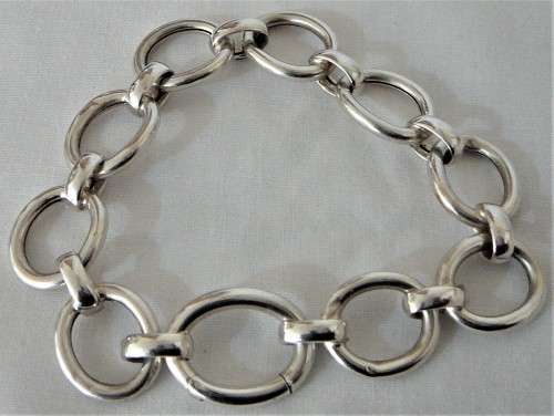 A Silver Bracelet of Hollow Silver Rings with an Unusual Hinged Ring Clasp