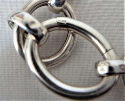 A Silver Bracelet of Hollow Silver Rings with an Unusual Hinged Ring Clasp