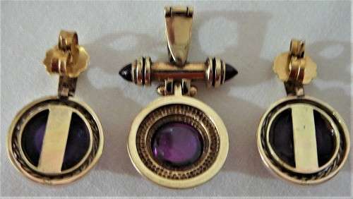 A Really Stunning Earrings and Pendant set of Amethysts and 2 Bullet Garnets set into 9ct Gold