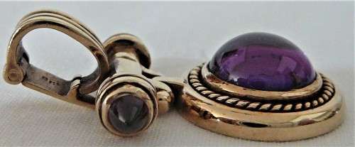 A Really Stunning Earrings and Pendant set of Amethysts and 2 Bullet Garnets set into 9ct Gold