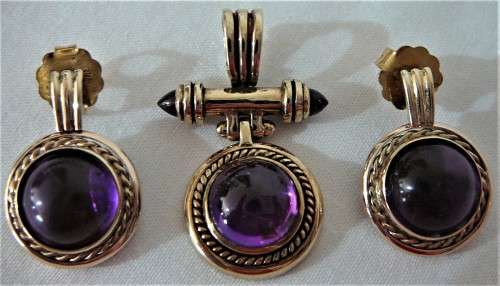 A Really Stunning Earrings and Pendant set of Amethysts and 2 Bullet Garnets set into 9ct Gold