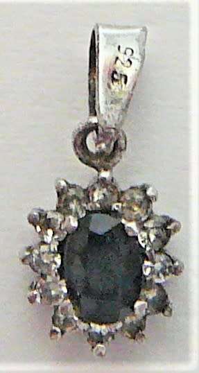 A  Very Elegant Small Sterling Silver Pendant set with an Oval Blue CZ and Tiny White CZs