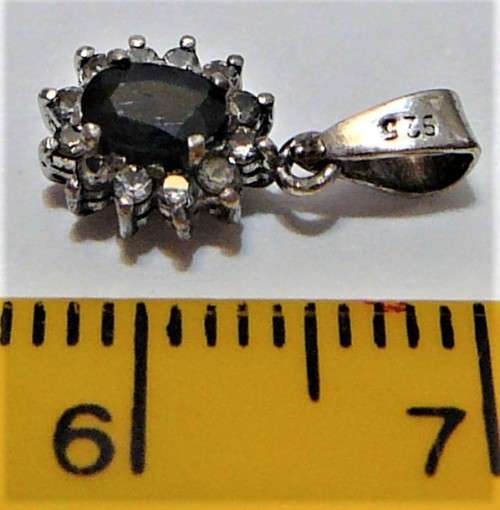 A  Very Elegant Small Sterling Silver Pendant set with an Oval Blue CZ and Tiny White CZs