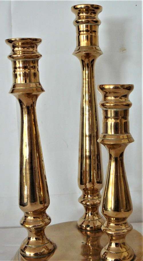 A Solid Brass Triple Candle Holder on a Round Base