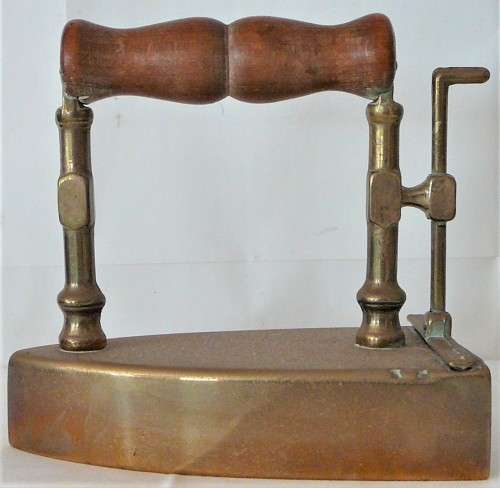 A Wooden Handled Solid Brass Smoothing Iron