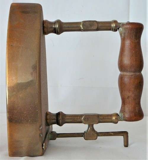 A Wooden Handled Solid Brass Smoothing Iron