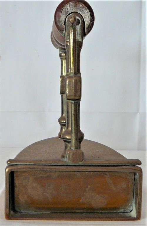 A Wooden Handled Solid Brass Smoothing Iron