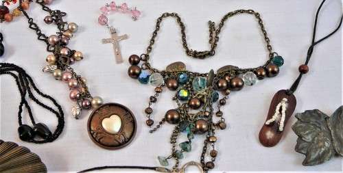 An Assortment of Costume Jewellery - Necklaces and Brass Buckles
