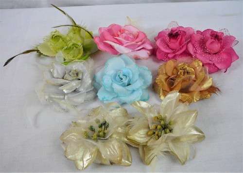 An Assortment of Pin on Silk and Feather Flowers