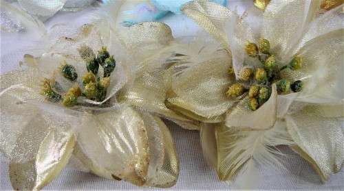 An Assortment of Pin on Silk and Feather Flowers