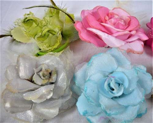 An Assortment of Pin on Silk and Feather Flowers