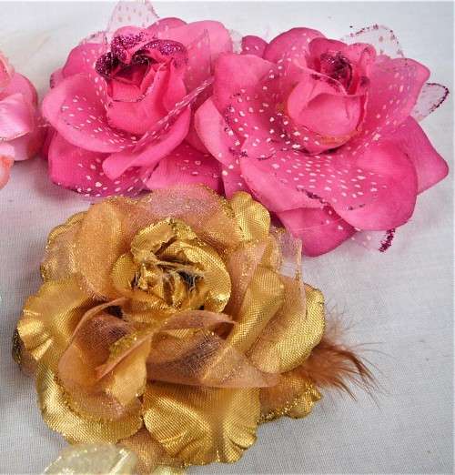 An Assortment of Pin on Silk and Feather Flowers