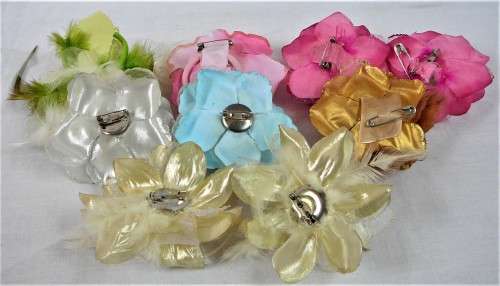 An Assortment of Pin on Silk and Feather Flowers