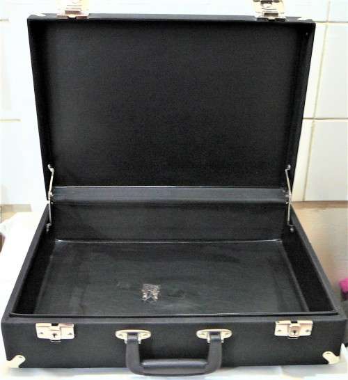 An Unused Small Black Suitcase in Excellent Condition