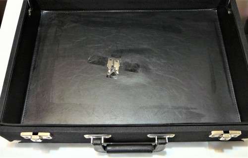 An Unused Small Black Suitcase in Excellent Condition