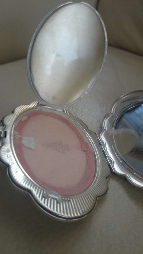 Powder compact