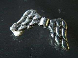 Angel wings bead in nickel silver. 19.2 mm with 2 mm hole
