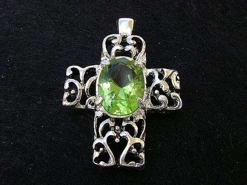 Cross pendant with green rhinestone