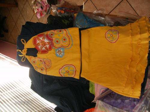 orange yellow skirt and halterneck top