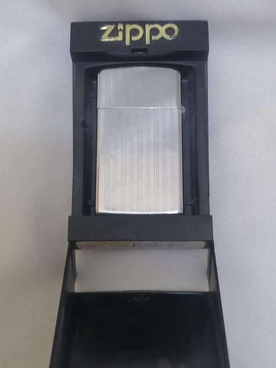 VINTAGE - ZIPPO LIGHTER IN ORIGINAL HOLDER - GOOD WORKING CONDITION - PLEASE READ BELOW.