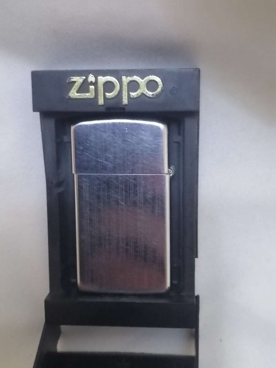 VINTAGE - ZIPPO LIGHTER IN ORIGINAL HOLDER - GOOD WORKING CONDITION - PLEASE READ BELOW.