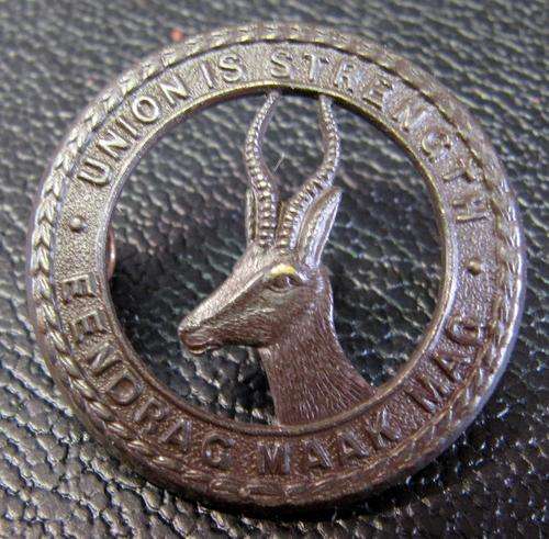 South African Defence Force cap badge - Union is strength - Springbok facing left, 32mm