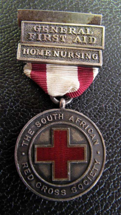 The SA Red Cross Society Proficiency silver medal with 'General First Aid' & 'Home Nursing' clasps