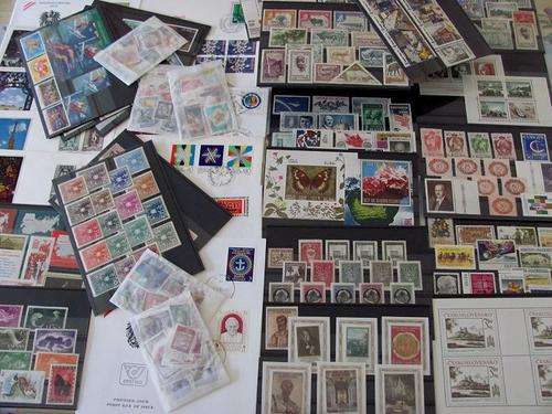 Box Lot - World  MINT STAMPS LOT covers as shown- unsorted stamps Lot on many black