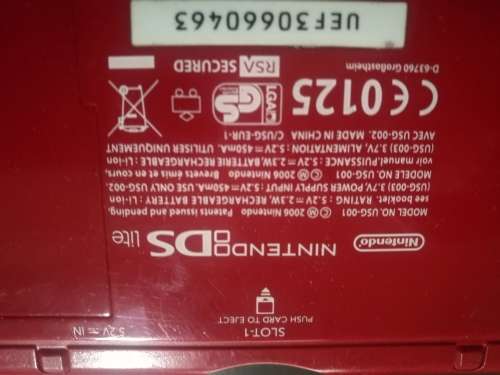 Red Nintendo DS Lite and 4 Games
