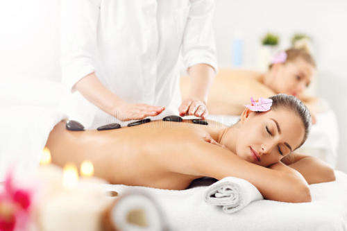 30 Minute Hot Stone Massage and a Deluxe Pedi or Mani for two people