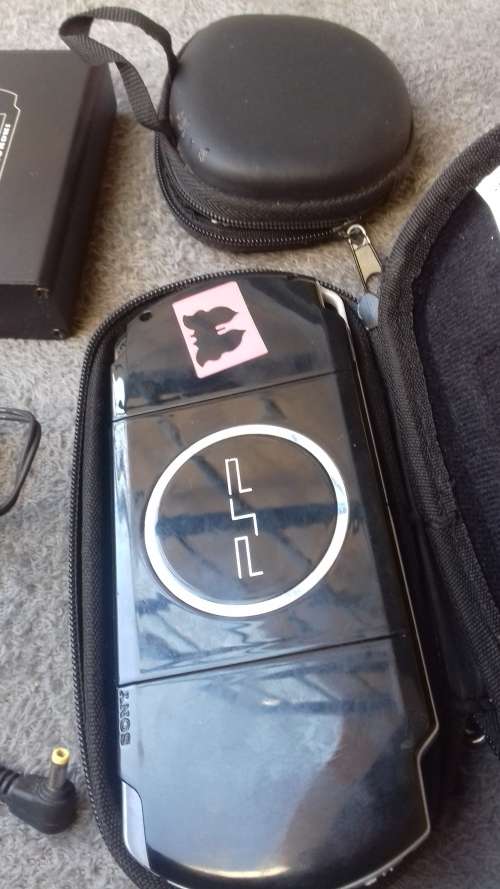 PSP, 5 games, charger and a PSP converter