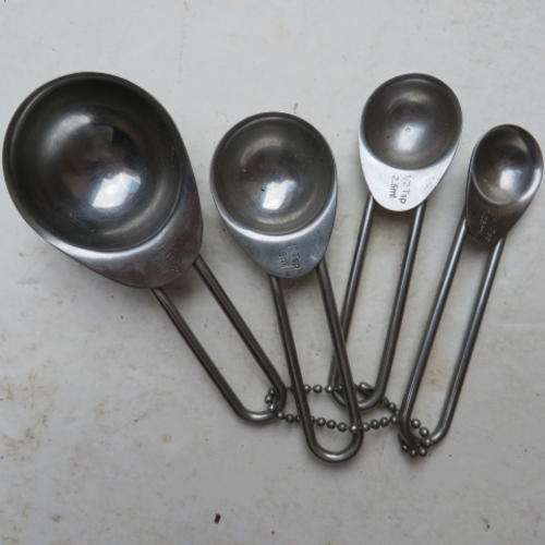 FOUR VARIOUS MEASURING SPOONS
