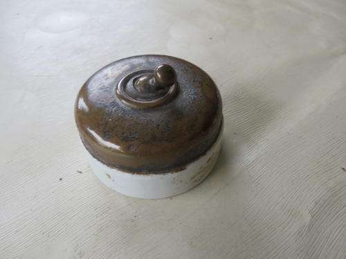 PORCELAIN / BRASS LIGHT SWITCH - 55 MM DIAM. -   NOT CLEANED OR POLISHED - AS PER SCAN