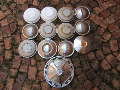 13 UNKNOWN HUB CAPS AS ONE LOT - AS PER SCAN