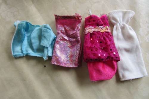 9 VARIOUS DOLLS DRESSES - ASER SCAN