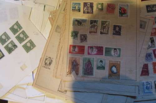 79 PAGES WITH HINGED WORLD STAMPS - BID PER PAGE