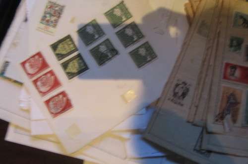 79 PAGES WITH HINGED WORLD STAMPS - BID PER PAGE
