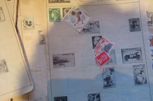 79 PAGES WITH HINGED WORLD STAMPS - BID PER PAGE