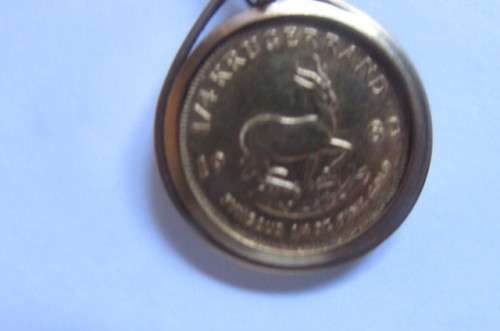 CHRISTMAS IS COMINGBEAUTIFUL FRAMED 1/4 KRUGER RAND - 1983 WITH UNKNOWN STONE - 11.2.G - AS PER SCAN