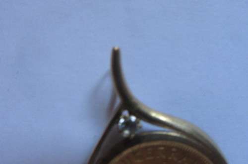 CHRISTMAS IS COMINGBEAUTIFUL FRAMED 1/4 KRUGER RAND - 1983 WITH UNKNOWN STONE - 11.2.G - AS PER SCAN