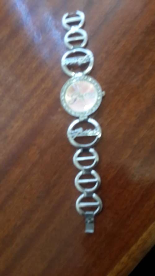 LADIES GUESS WATCH SECONDHAND- one stone missing ...cant really see