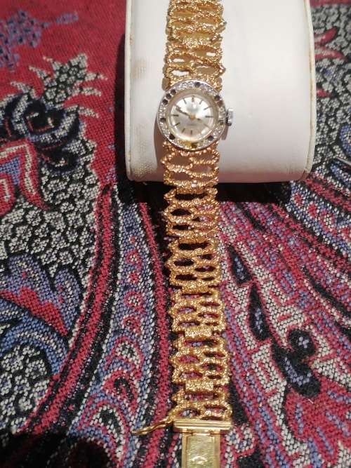 A Ladies Precimax Stylish Cocktail watch with gold clad strap