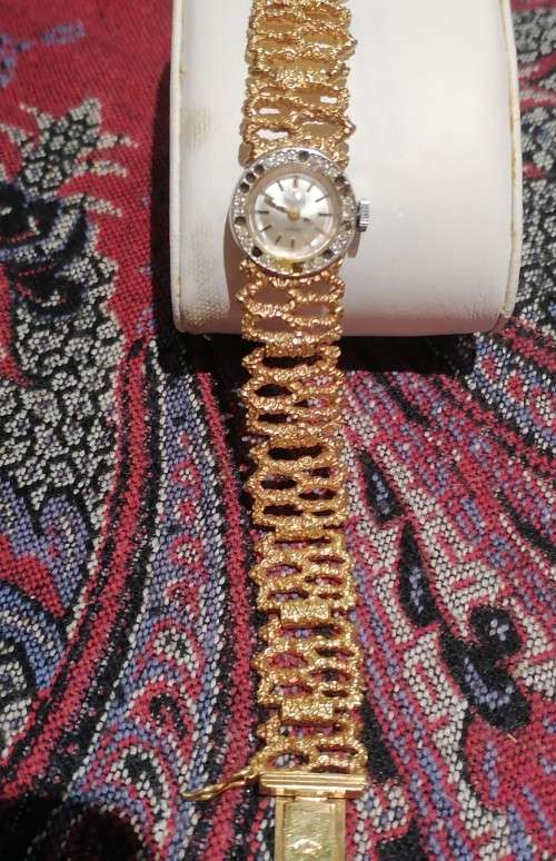 A Ladies Precimax Stylish Cocktail watch with gold clad strap