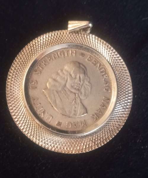 A Silver pendant with SA silver coin