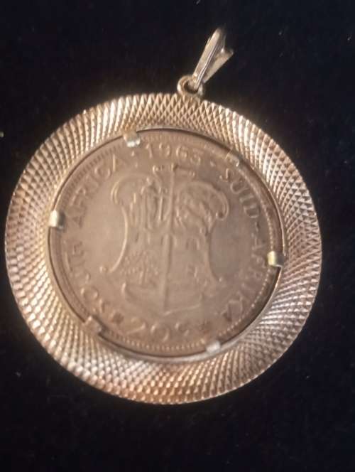 A Silver pendant with SA silver coin