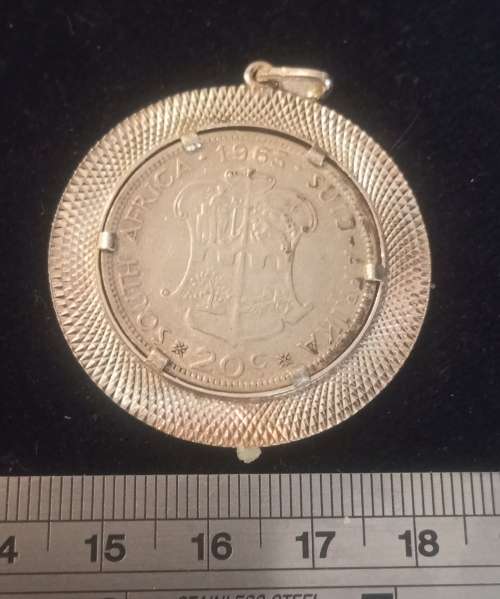 A Silver pendant with SA silver coin