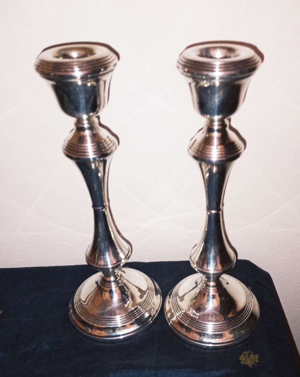 A lovely pair of silver candlesticks