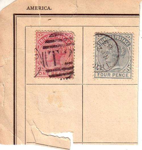 A few very old Trinidad stamps on piece of album page